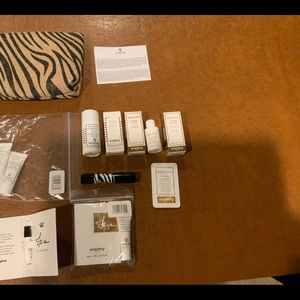 Sisley LOT of 12 sample items and make up bag